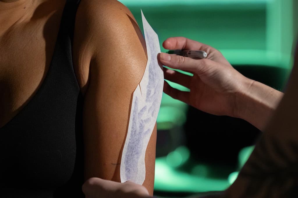 Kait Rogers Tattooing a Client